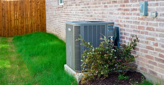 Outdoor HVAC unit near foliage